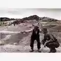 Robert Capa Shepherd shows the way an american soldier